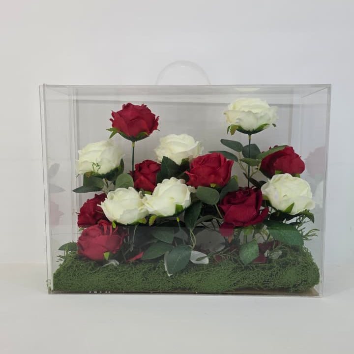 Box of red and white roses on a white background